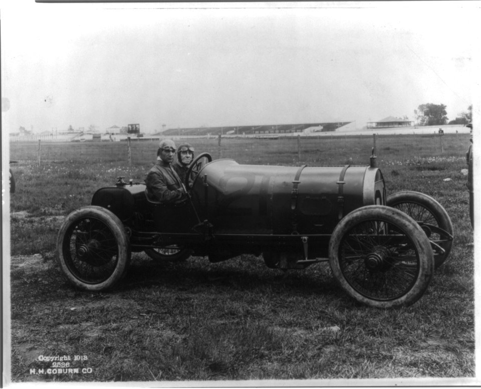 Unidentified men seated in racing cars LCCN2004679601