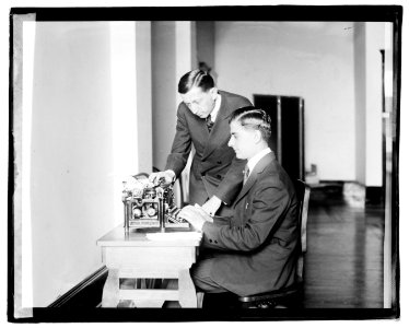 Unidentified men using typing machine LOC npcc.04418