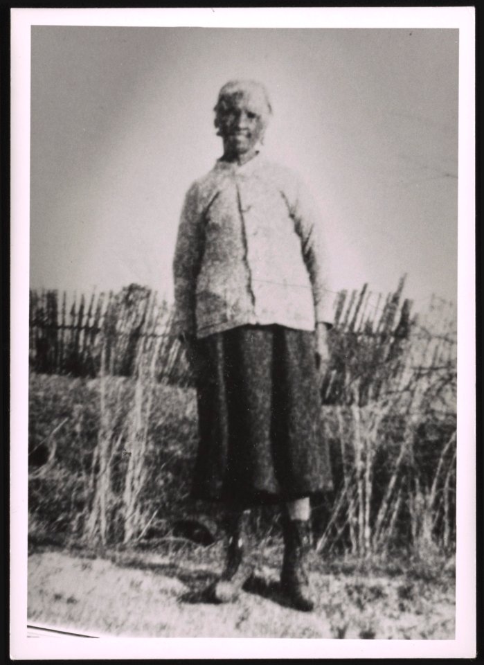 Unidentified older woman standing on dirt road LCCN2015650132