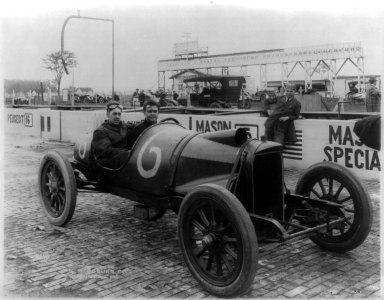 Unidentified men seated in racing cars LCCN2004679603