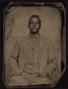 Unidentified man, about 19 or 20 years of age, three-quarter length portrait, seated, facing front LCCN2015650120