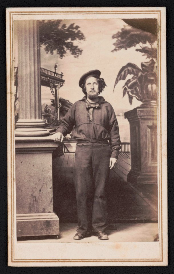 Unidentified sailor in Union uniform in front of painted backdrop) - B. Bingham's Gallery, No. 218 Main Street, Memphis, Tennessee LCCN2017659632
