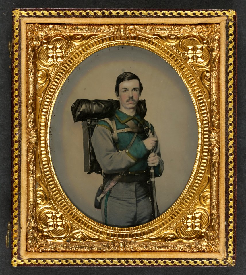 Unidentified soldier in Confederate uniform of Company E, Lynchburg Rifles, 11th Virginia Infantry Volunteers holding 1841 Mississippi rifle, Sheffield-type Bowie knife, canteen, box LCCN2010650215