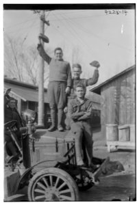 Unidentified men posing on automobile LCCN2014704721