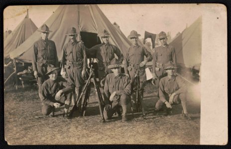 Unidentified soldiers in uniform with rifles in front of tents LCCN2018645979