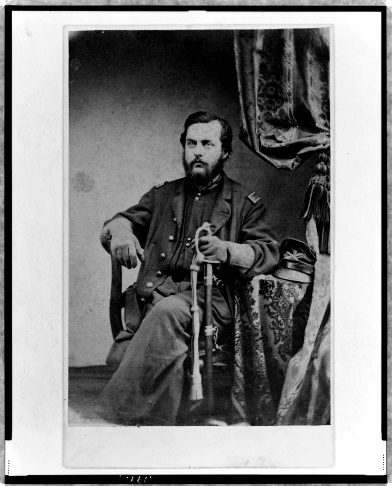 Unidentified Union officer, three-quarter length, seated, with left hand on sword, facing slightly left LCCN98506752