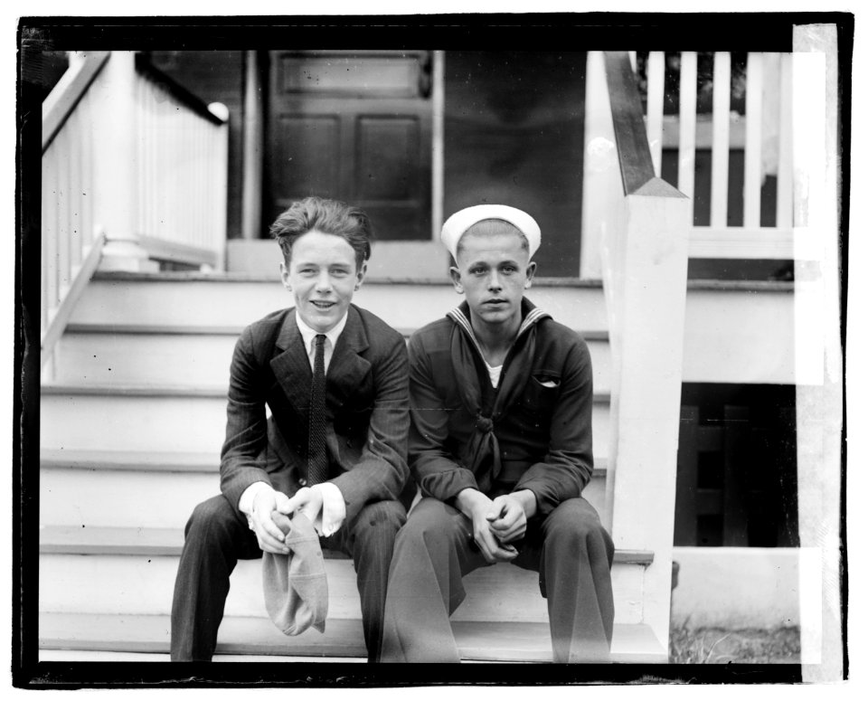 Unidentified young man and sailor seated on porch steps LOC npcc.04222