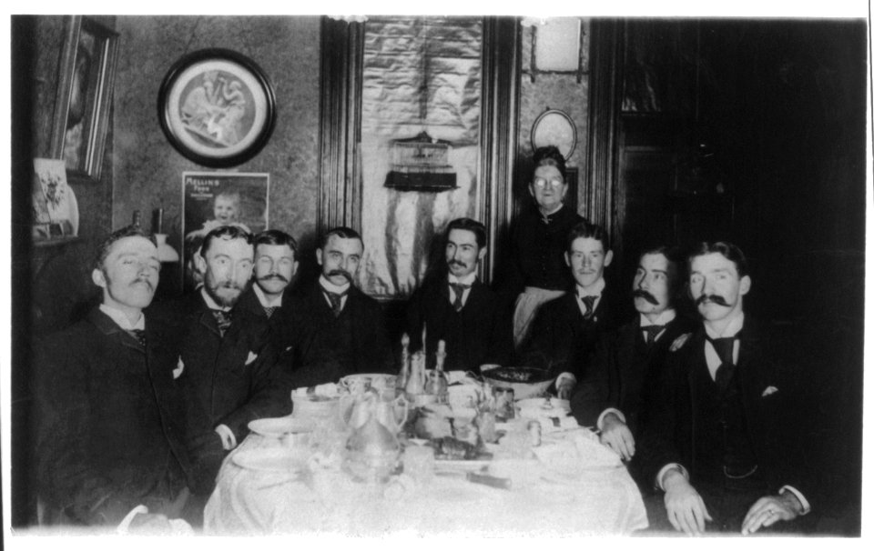 Unidentified- group of young men at dinner table LCCN2016651826