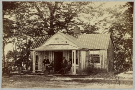 Union army soldiers seated on a porch with three other men LCCN2012648422