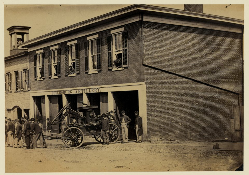 Union soldiers pull a fire engine from a garage designated Petersburg artillery LCCN2005684445