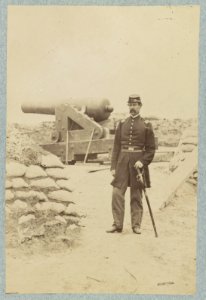 Union officer standing in an unidentified fort in front of a cannon LCCN2013648720