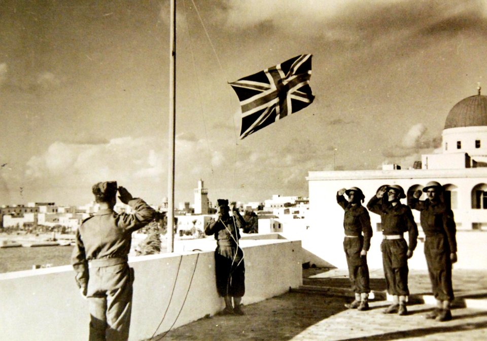 Union Jack being hoisted on Italian flagpole in Benghazi after the city’s recapture, WWII (36406677994)