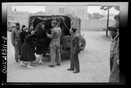 United States Army nurses being helped into the back end of a truck somewhere in Iran8d29624v