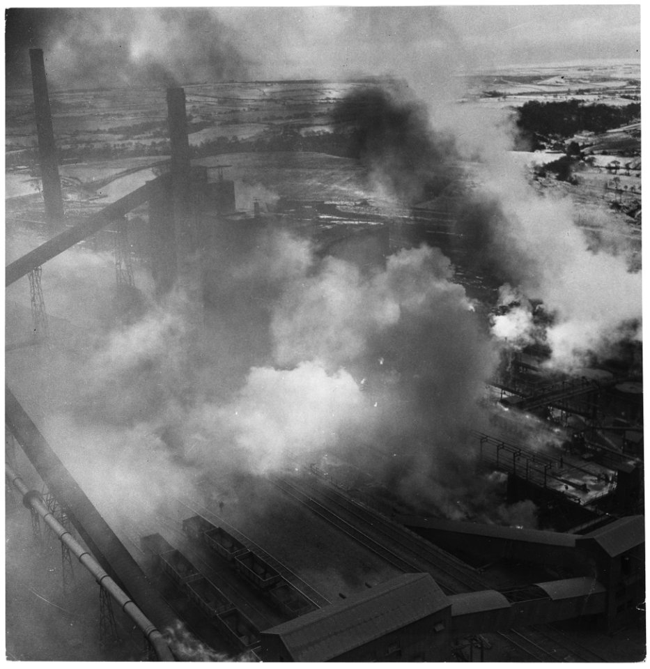 United Kingdom. Consett, England. Night and day, seven days and seven nights a week, whirling smoke cloud rise from... - NARA - 541767