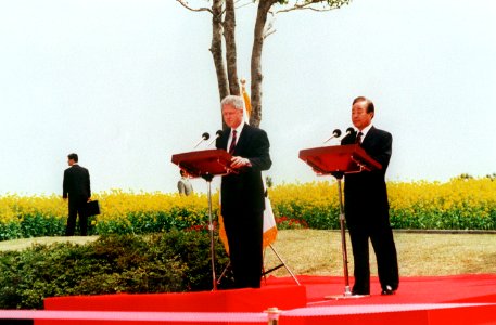 United States President William J. Clinton and South Korean President Kim Yong Sam at podium in Chejudo