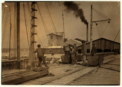 Unloading oysters on the dock. Alabama Canning Co.,. LOC cph.3a29844