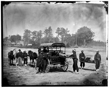 Unknown location. Zouave ambulance crew demonstrating removal of wounded soldiers from the field; another view LOC cwpb.04095