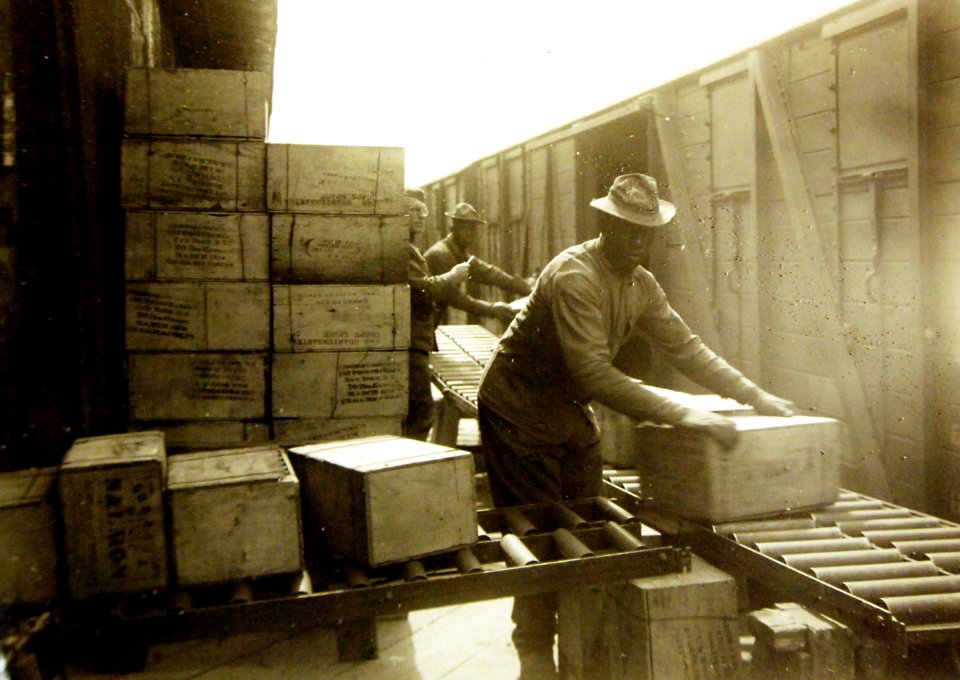 Unloading subsistence from railcar into Q.M. Warehouse, Dijon, France, 1918 (28648765635)