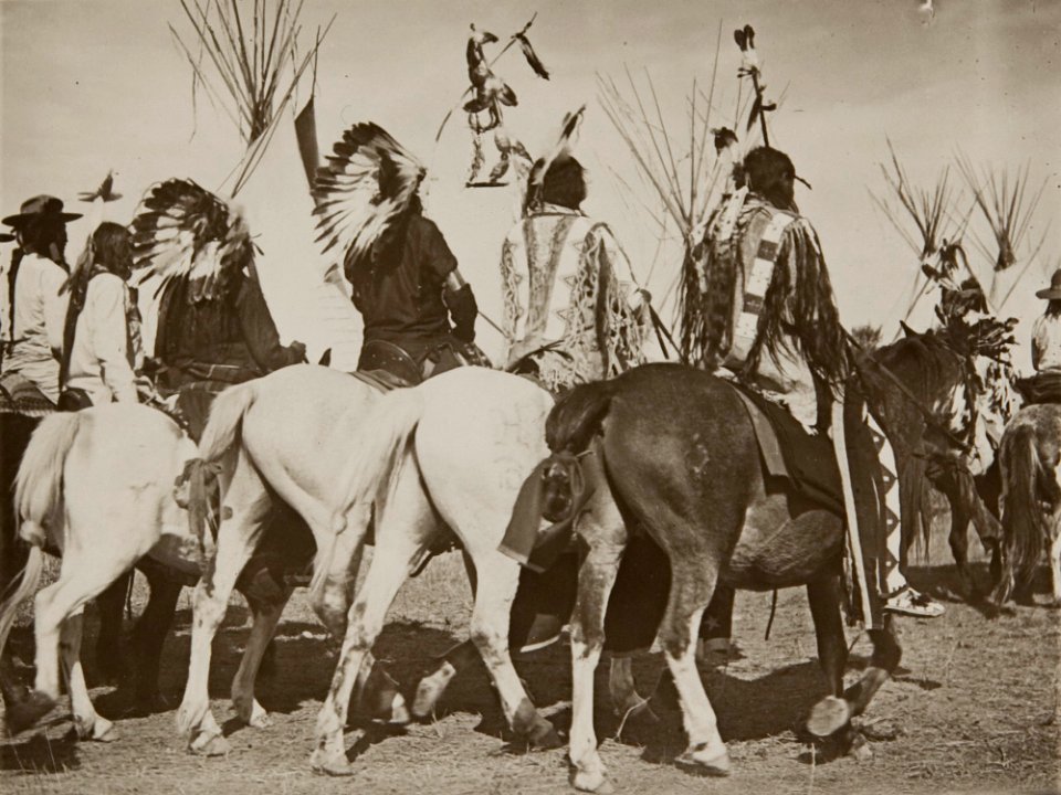 Untitled (Rear view of Native Americans riding)