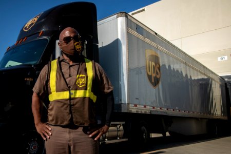 UPS semi truck driver in front of semi-trailer truck in Arlington Texas