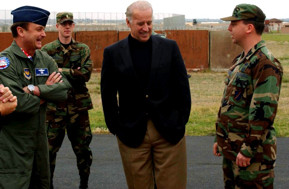 US Air Force Colonel Marc Felman shares a light moment with Senator Joe Biden and Lieutenant Colonel Jeffery Linskens