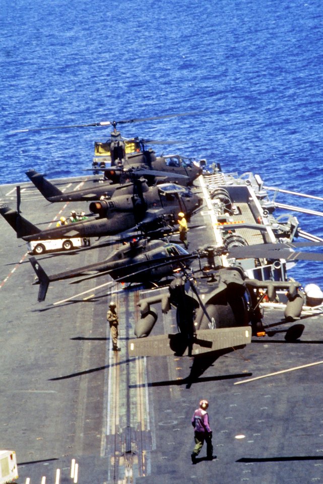 US Army helicopters on forward flight deck of USS Eisenhower (CVN-69) off Haiti in 1994