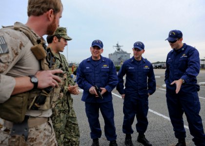 US Coast Guard liaison officers during a visit to Navy Expeditionary Combat Command 131115-N-MD211-071