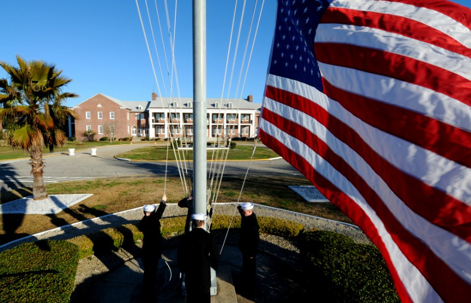 US Navy 010125-N-5328N-583 Students at the Center for Information Dominance Corry Station raise the national ensign during morning colors