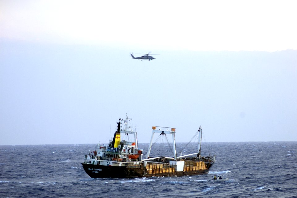 US Navy 020127-F-0000X-001 SH-60 helicopter observes merchant during MIO