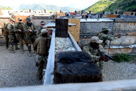 US military combat cameramen practice close quarter battle techniques 150219-N-FN215-077