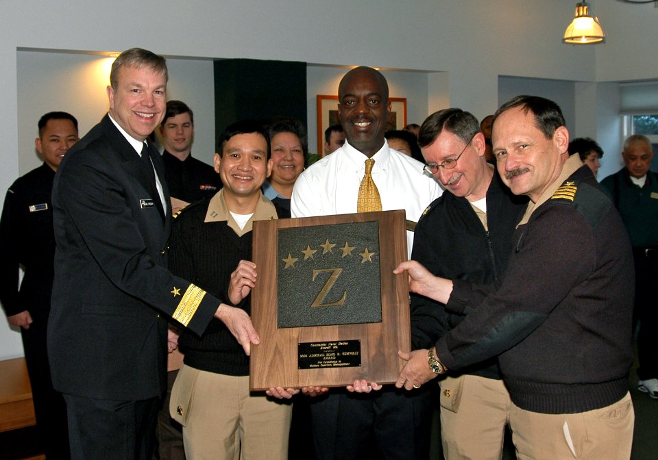 US Navy 011007-N-3390M-001 Commander Navy Region Northwest Rear Adm. Bill French and Naval Station Everett Commanding Officer Capt. Eddie Gardiner holds the base's fifth consecutive Five Star Admiral Elmo R. Zumwalt Award