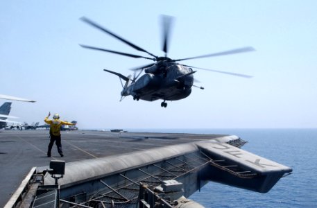 US Navy 020801-N-6492H-501 An MH-53E Sea Dragon helicopter leave the flight deck aboard CV 67
