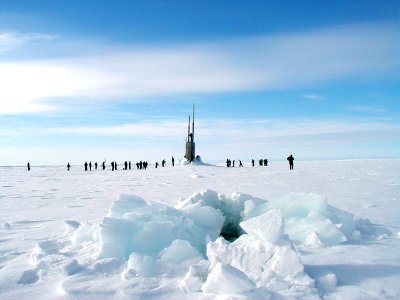 US Navy 010605-N-0000X-002 Sailors stationed aboard the Los Angeles-class fast attack submarine USS Scranton (SSN 756) explore the Arctic ice surface