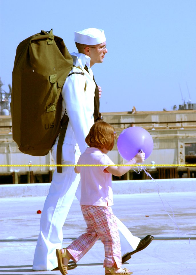 US Navy 020416-N-4374S-505 Sailor walks with his daughter after returning from deployment