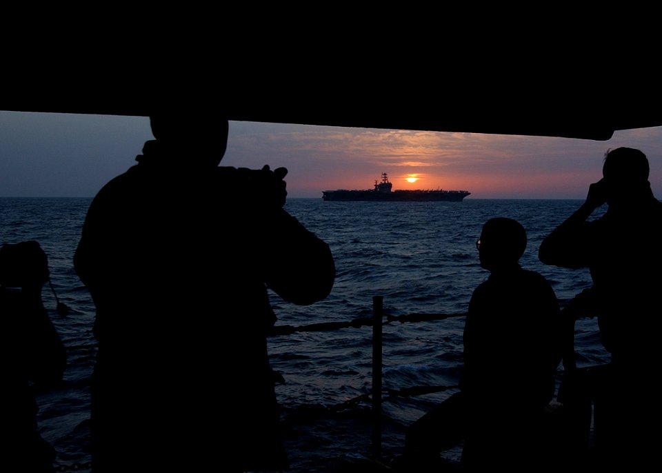 US Navy 020306-N-6492H-519 Sunrise over USS Roosevelt (CVN 71)
