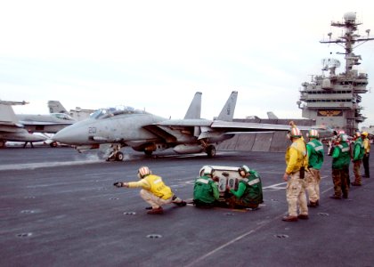 US Navy 020319-N-6492H-516 F-14 Tomcat readies for launch aboard USS John F. Kennedy photo