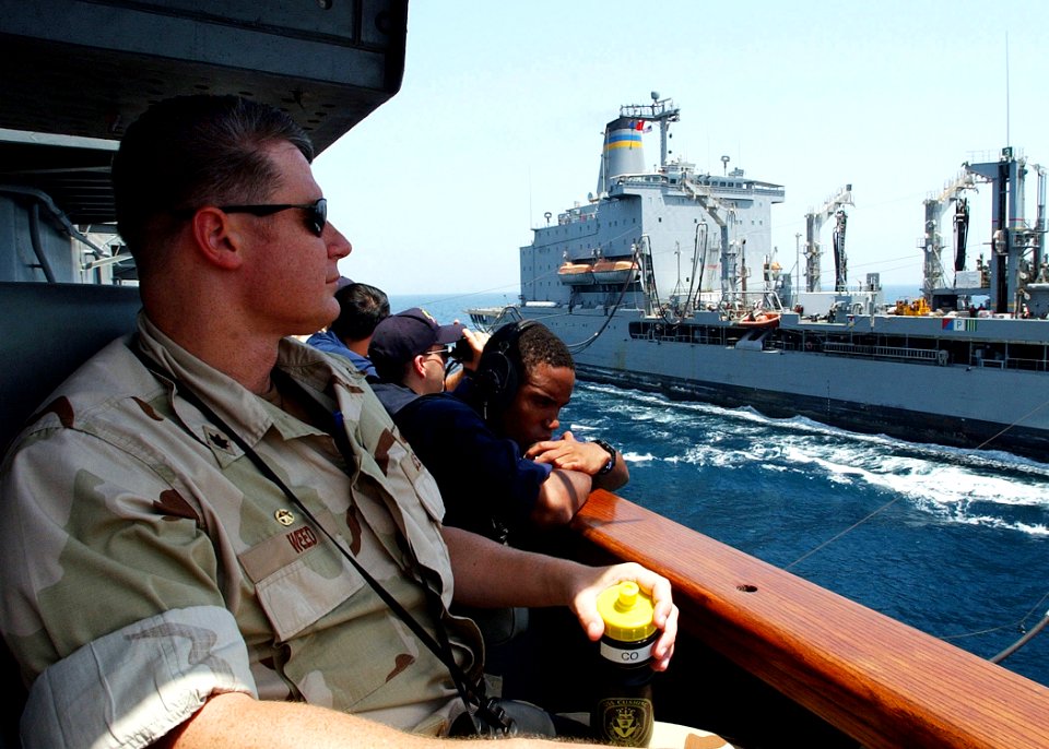US Navy 020626-N-4374S-008 At sea aboard USS Cushing (DD 985) Jun. 26, 2002 - Ship's Commanding Officer, Commander Daniel Weed, observes an underway replenishment (UNREP)