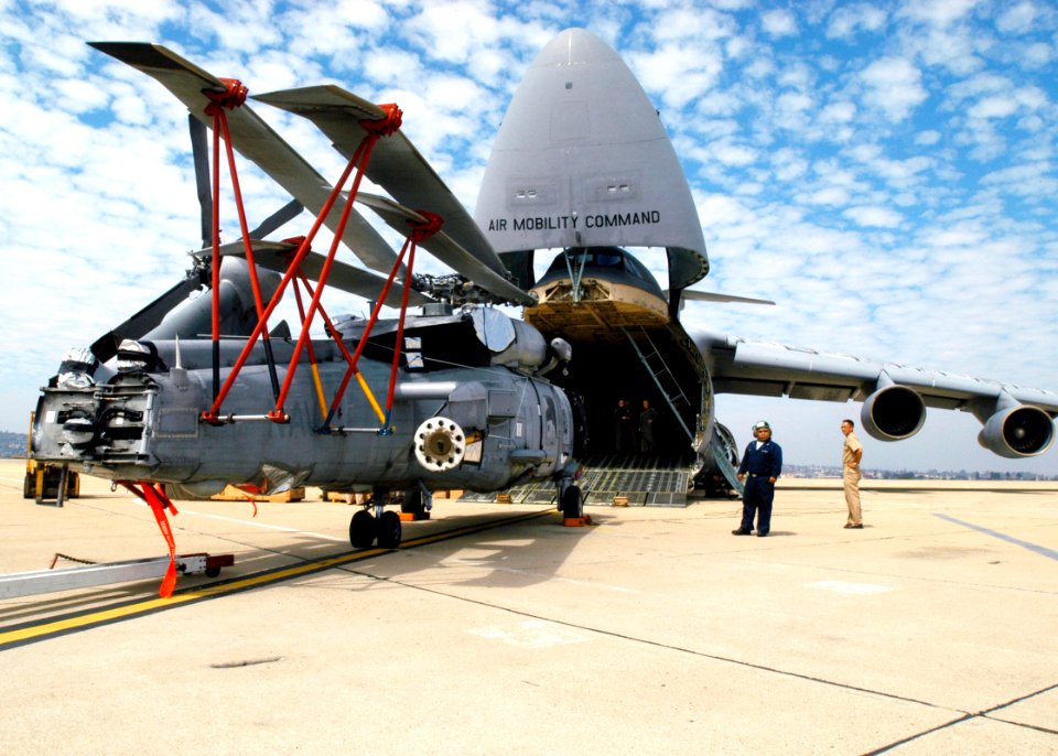 US Navy 020925-N-8629M-001 An SH-60B Sea Hawk from Helicopter Anti-Submarine Squadron Four Three (HSL 43) is prepared to be loaded onto an Air Force C-5B Galaxy