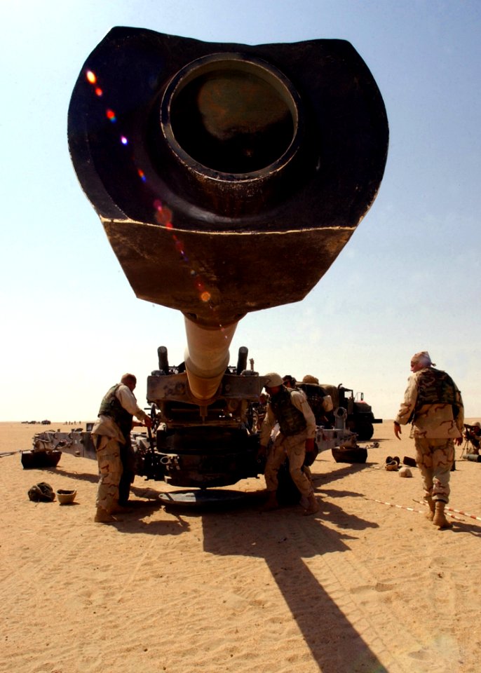 US Navy 021003-N-4374S-033 U.S. Marines assigned to Charlie Battery of the 11th Marine Expeditionary Unit (Special Operations Capable) make final adjustments on an M-198 Howitzer