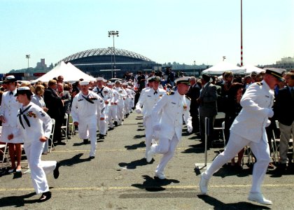 US Navy 020622-N-8252B-010 Sailors stationed aboard USS Shoup run to man the rails during the commissioning ceremony