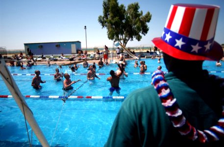 US Navy 020704-N-5471P-007 Service members enjoy a break during 4th of July celebrations, while deployed in Kuwait photo