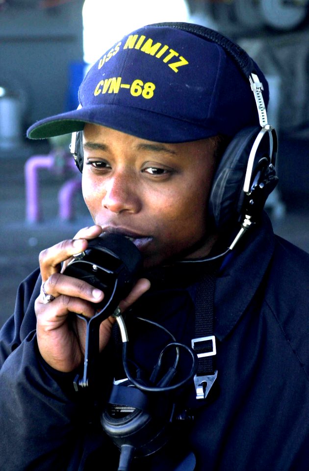 US Navy 020922-N-0413R-003 Aft Look out communicates on sound-powered phone with the ship's bridge