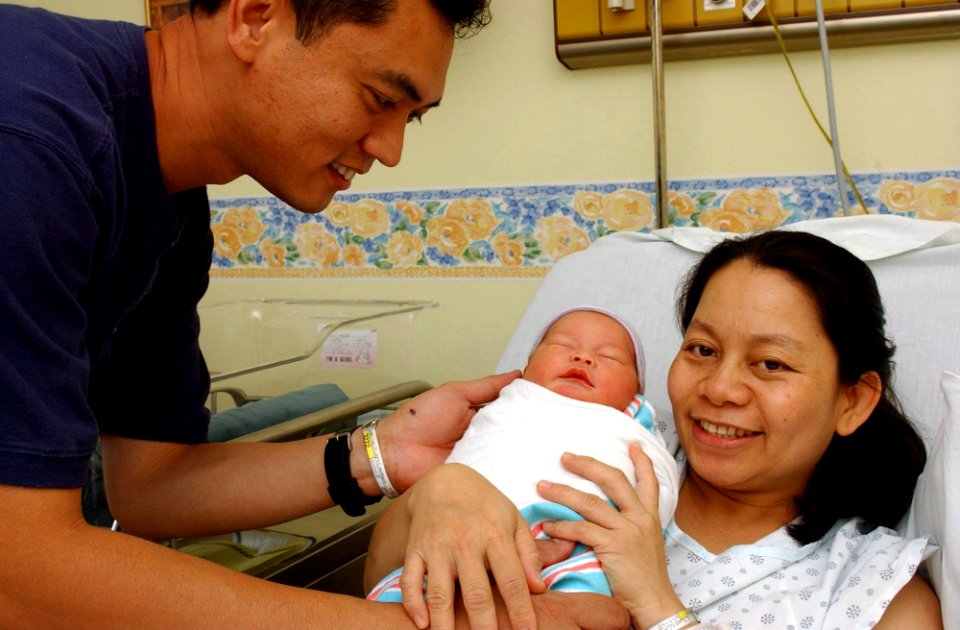 US Navy 021011-N-9849W-001 New parents celebrate the arrival of their baby