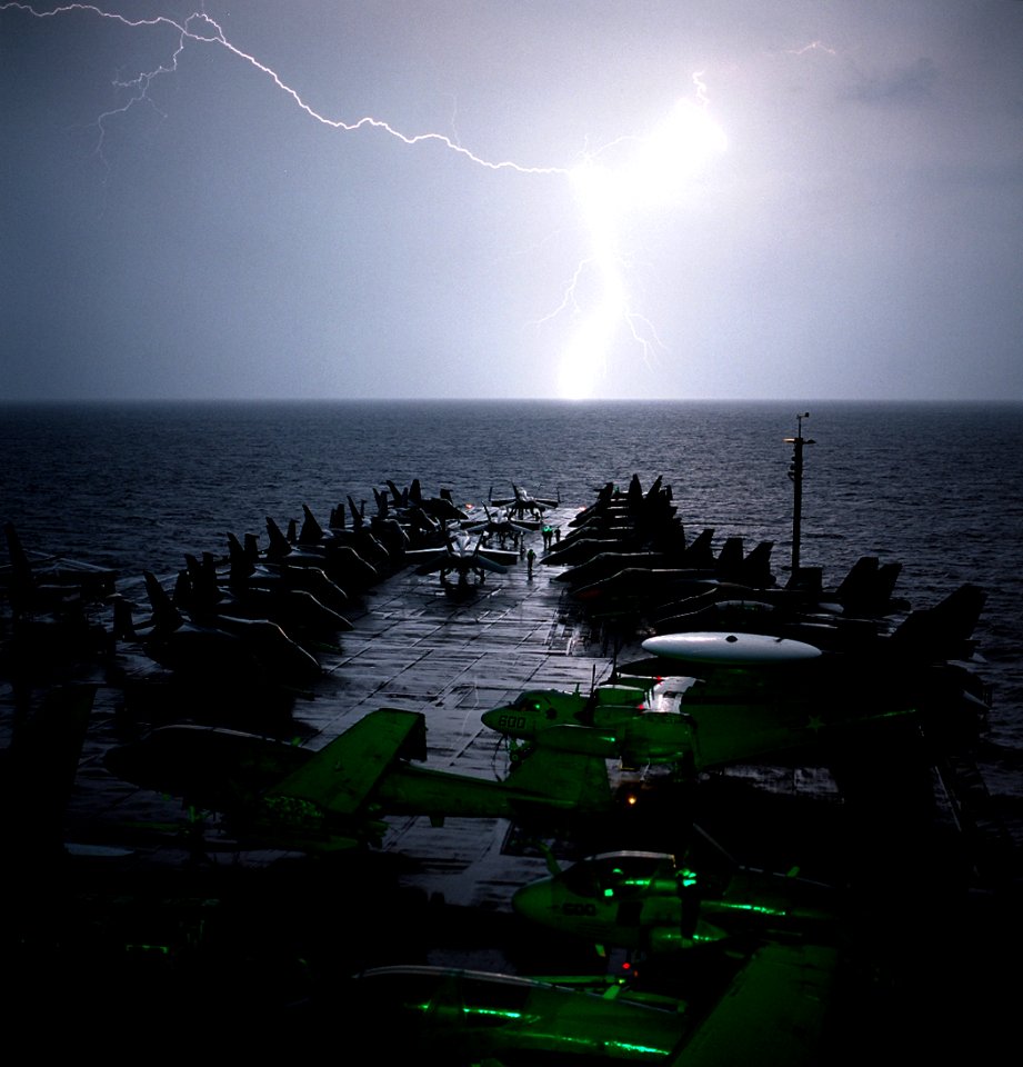 US Navy 021101-N-4309A-003 Lightning strikes light up the bow of USS Abraham Lincoln