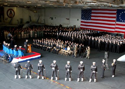 US Navy 021109-N-6433N-001 Sailors aboard the Washington attend a memorial service held in the ship's hangar bay for Lieutenant Commander Robert Clukey III