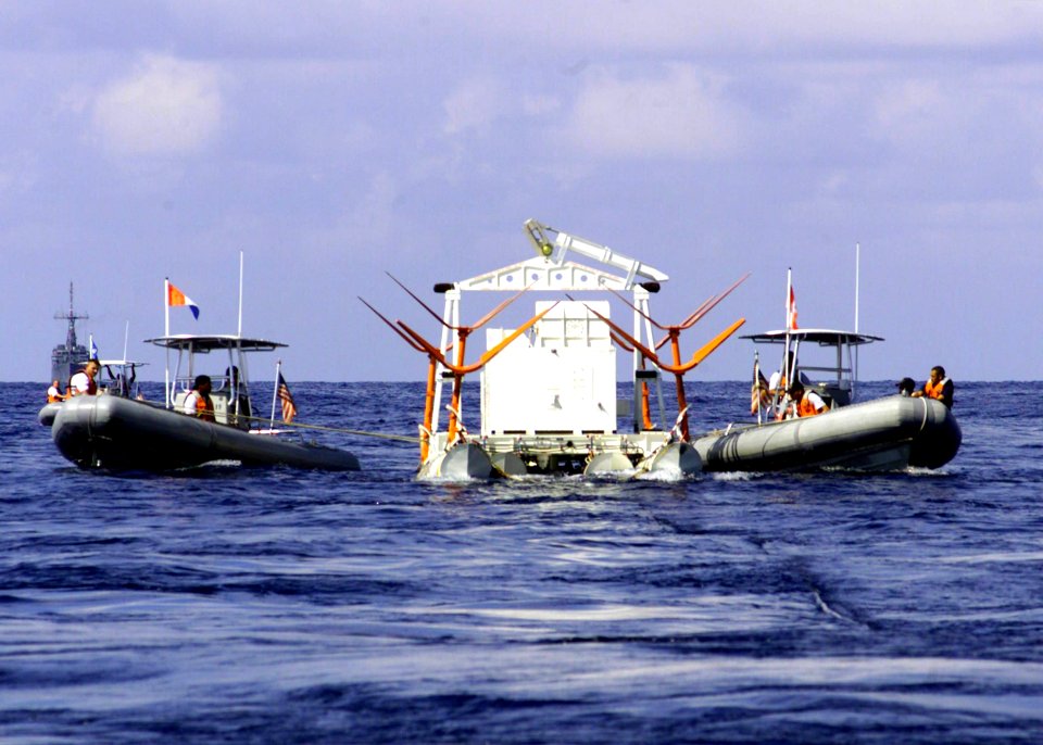 US Navy 021021-N-2972R-567 Sailors assigned to the Blackhawks of Helicopter Mine Countermeasures Squadron One Five (HM-15), provide towing support to a MK-105 Magnetic Influence Minesweeping System (Hydrofoil)