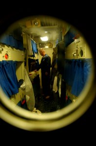 US Navy 021022-N-4309A-053 Hull Technician 1st Class John O'Donnell prepares for his daily workday aboard the ship, in his berthing area aboard the guided missile frigate