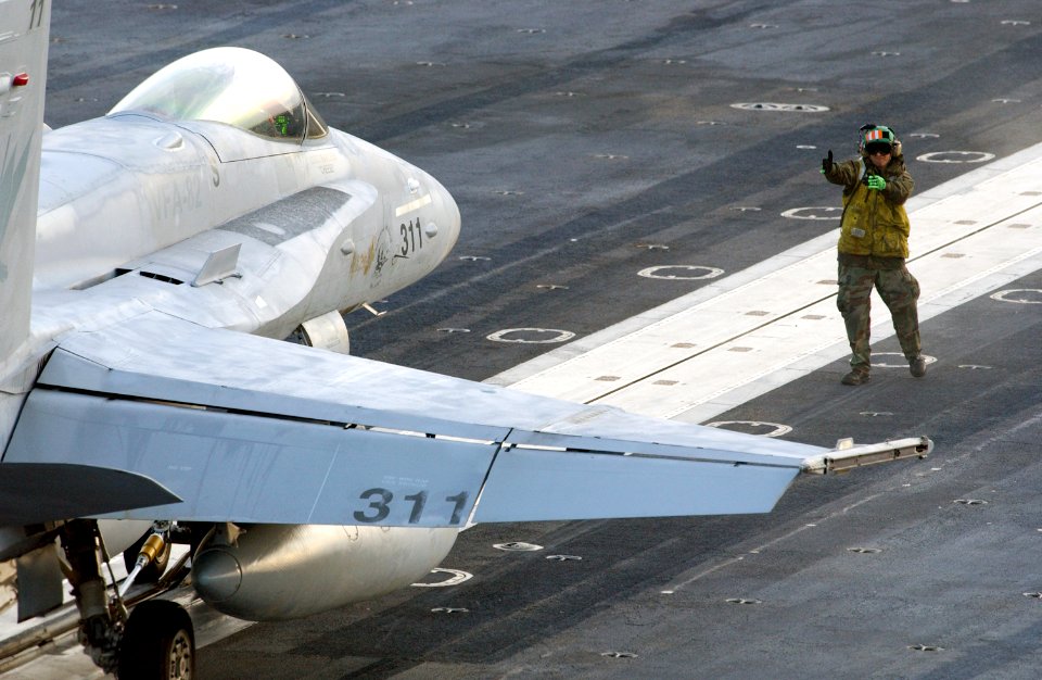 US Navy 021109-N-1328C-501 Directing a Hornet to a catapult