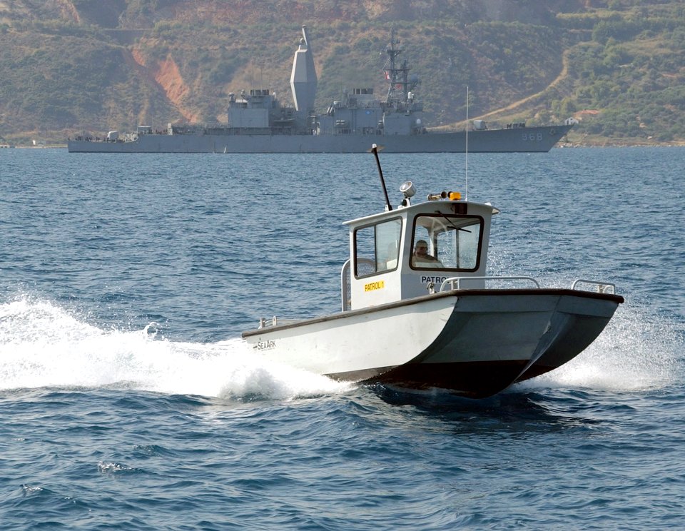 US Navy 020830-N-0780F-006 A Naval Support Activity patrol boat keeps watch over harbor activities in Souda Bay, Crete, Greece