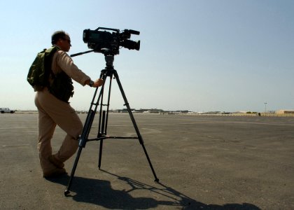 US Navy 021024-N-4374S-026 Photographer's Mate 2nd Class Richard Virginia assigned to Fleet Combat Camera, Atlantic, stands ready to capture video imagery of an EP-3E Aries II assigned to the